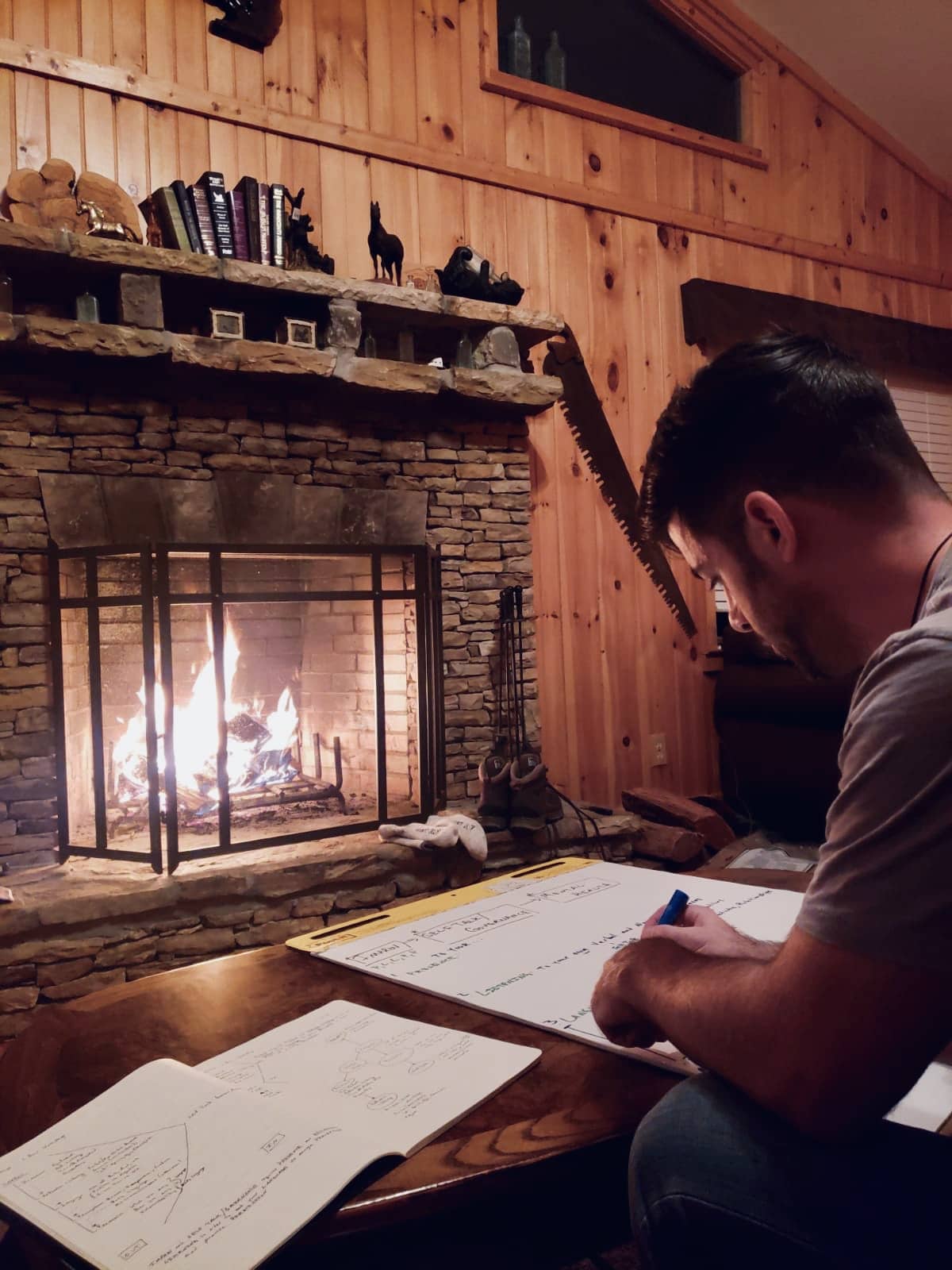 Steven Mindmapping in front of fireplace